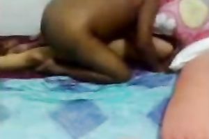 Amateur black haired Indian wifey lets her hubby spoon her on ottoman