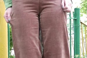 Cute and small Russian playgirl changes raiment outside