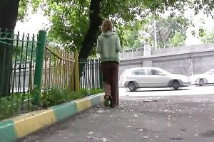 Cute and small Russian playgirl changes raiment outside