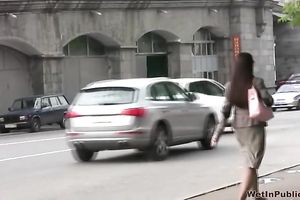 Cute and small Russian playgirl changes raiment outside