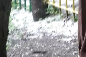 Cute and small Russian playgirl changes raiment outside