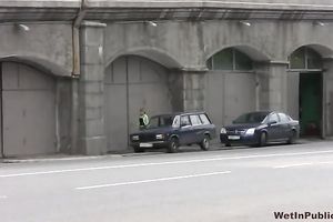 Cute and small Russian playgirl changes raiment outside