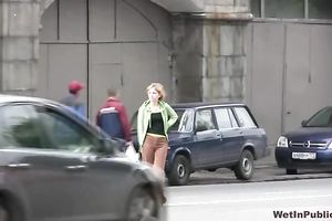 Cute and small Russian playgirl changes raiment outside