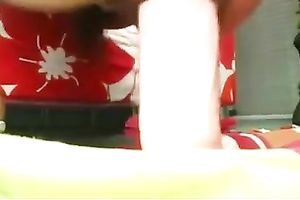 Sassy floozy with large bumpers stretching her pussy with huge dildo