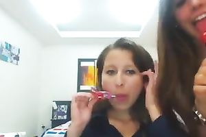 Four breathtaking dark brown gals disrobe and play with their constricted breasts