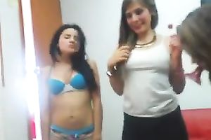 Four breathtaking dark brown gals disrobe and play with their constricted breasts