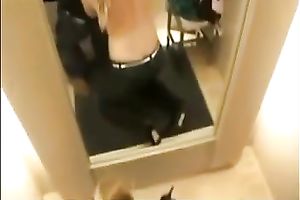 Blondie disrobes and begins engulfing my friend's lollicock in the changing room
