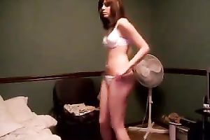 Beautiful brunette hair hottie undressing on a camera