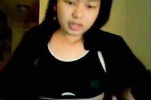 Asian juvenile cutie rubs her snatch and teats on cam