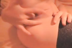 Wonderful light haired chick in dark nylons was fingering her own wet crack