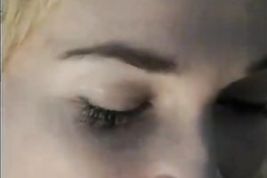 Cute golden-haired playgirl gives oral-stimulation to a white dude outside