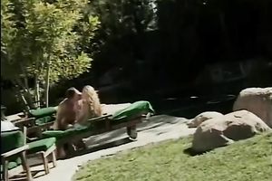 Cute golden-haired playgirl gives oral-stimulation to a white dude outside