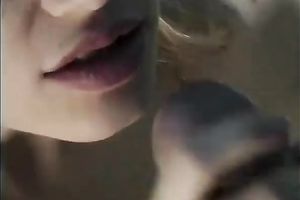 Cute golden-haired playgirl gives oral-stimulation to a white dude outside