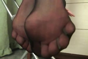 Sweet and cute juvenile sweetheart teases with her feet in dark hose