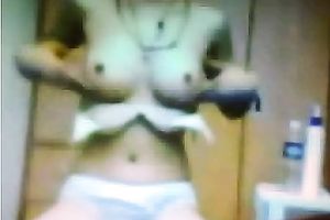 Skinny brunette hair student flashes her large firm boobs on livecam