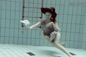 Cute European teenie caught on livecam in the pool underwater