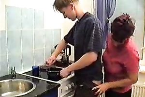 Sexy milf with shaggy snatch hitting on a youthful fellow in the kitchen