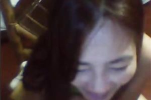 Mature Asian woman shows off her teats and touches her punani