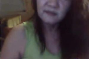 Mature Asian woman shows off her teats and touches her punani