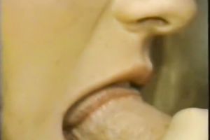 Cute golden-haired legal age teenager gives stout oral pleasure to a stylish dude in retro porn clip