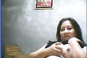 Salacious black-haired mom demonstrates her assets