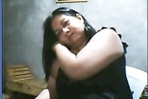 Salacious black-haired mom demonstrates her assets