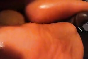 My fleshly cheating wife enjoys rubbing my black ramrod with her feet