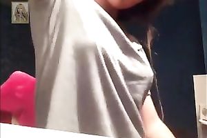 Light haired gal pulled down her grey T-shirt to expose her enjoyable boobies