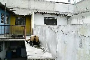 Dirty lady-boy in nylons and small belts masturbates on a roof