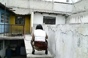 Dirty lady-boy in nylons and small belts masturbates on a roof