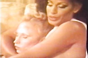 Two freaky retro milfs eat every other on the daybed