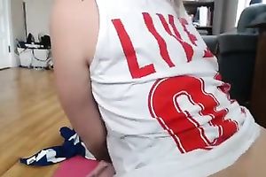 Tattooed golden-haired babe posing seductively in petite pink straps