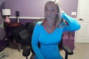 Sassy blond takes off her T-shirt and exposes large full natural bazookas