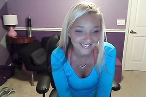 Sassy blond takes off her T-shirt and exposes large full natural bazookas