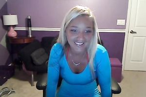 Sassy blond takes off her T-shirt and exposes large full natural bazookas