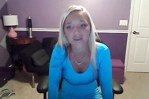 Sassy blond takes off her T-shirt and exposes large full natural bazookas