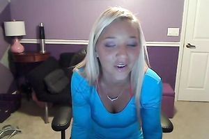 Sassy blond takes off her T-shirt and exposes large full natural bazookas