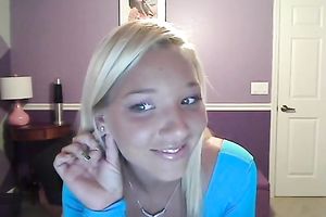 Sassy blond takes off her T-shirt and exposes large full natural bazookas