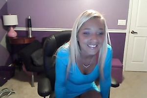 Sassy blond takes off her T-shirt and exposes large full natural bazookas