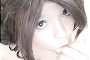 Busty milf licks and sucks a dildo in front of a cam