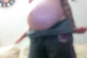 Tattooed whorable preggy with quite hot booty was flashing herself on web camera