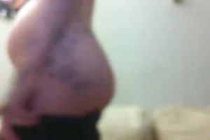 Tattooed whorable preggy with quite hot booty was flashing herself on web camera