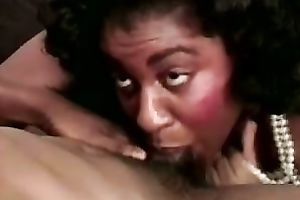 Cock hungry dark milf greedily sucks a large dark ramrod