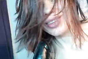 White whore on livecam blows a large dark fake penis and masturbates