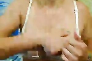 Busty milf widens her legs and shows her satin pants