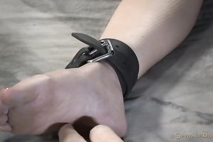 Crucified on the wide ottoman breasty brunette is drilled with dark toy