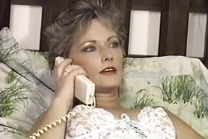 Dirty face sitting by the light haired woman on the ottoman