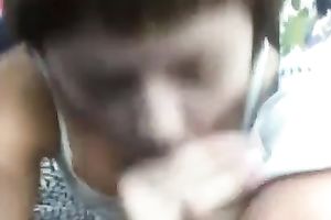 My short-haired aged woman gives me a head in the car