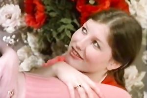 Blonde and brunette hair angels sharing one juvenile fellow on the sofa