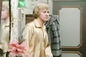 Blonde and brunette hair angels sharing one juvenile fellow on the sofa